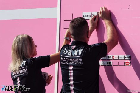 Force India personnel remove sponsors, Spa, 2018