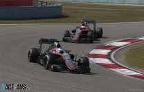 Fernando Alonso and Jenson Button on track.