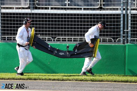 Marshals retrieve Daniel Ricciardo's wing, Albert Park, 2019
