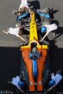 Lando Norris, McLaren MCL35, is pushed into the garage by mechanics