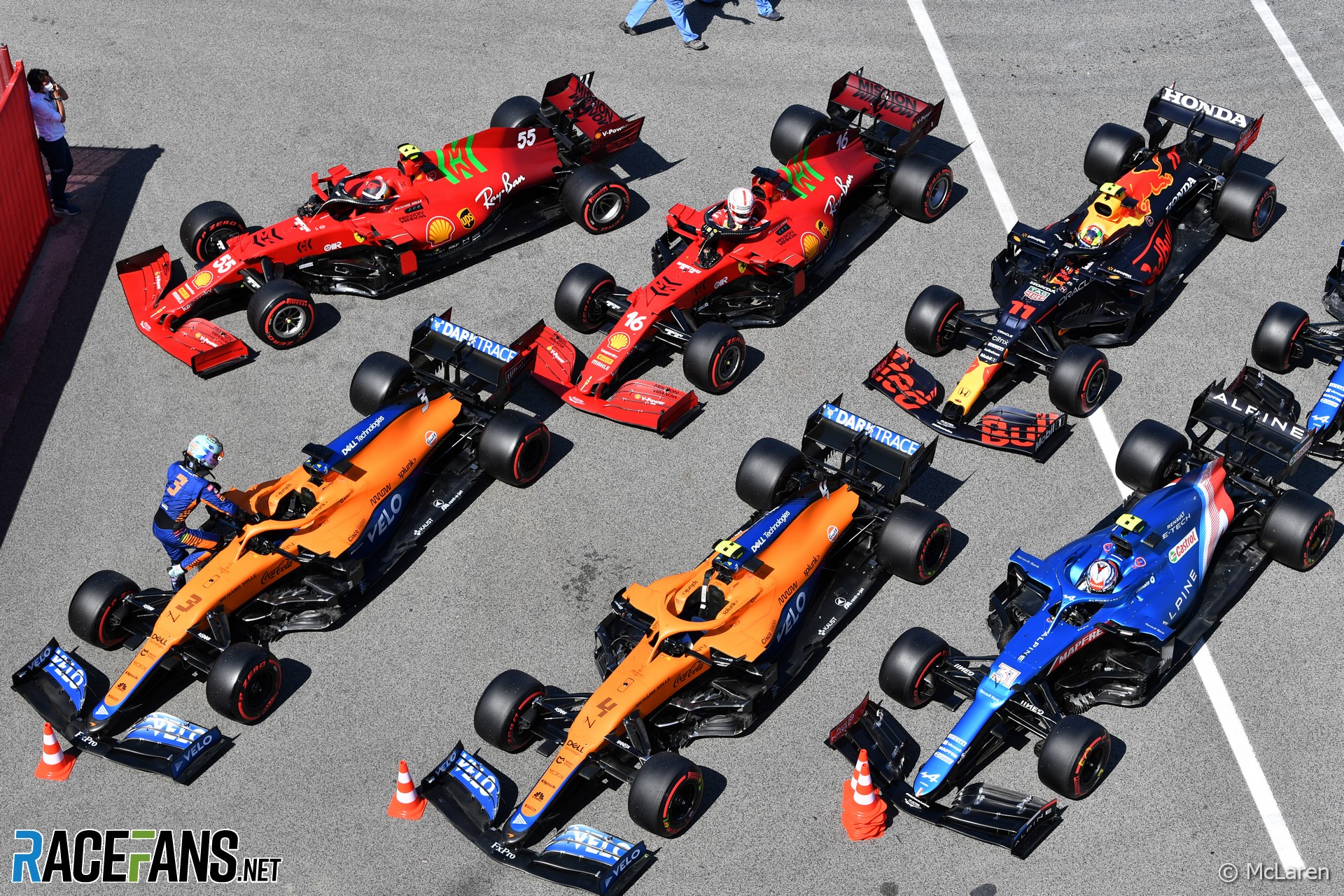 Ferrari, McLaren and Alpine cars - and Sergio Perez's Red Bull - in parc ferme after qualifying, Circuti de Catalunya, 2021