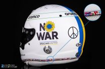 Vettel removes image of disputed flag from “No War” helmet after complaint to FIA
