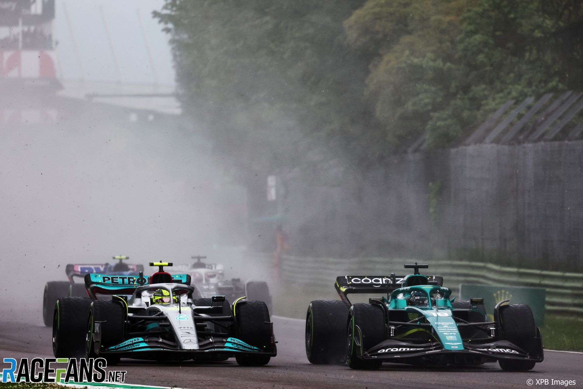 Lewis Hamilton, Mercedes, battles Lance Stroll, Aston Martin, for position, Imola, 2022