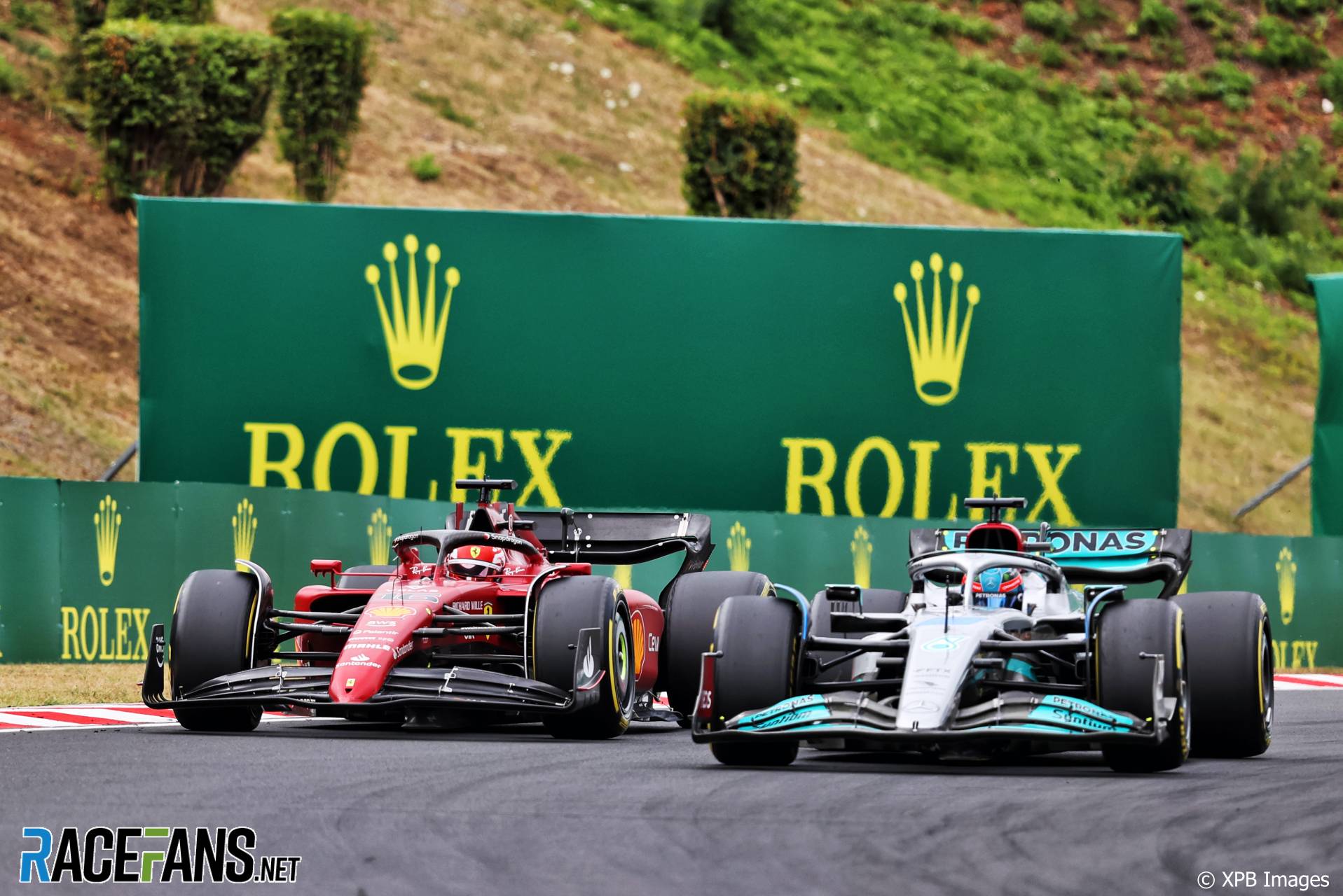 (L To R): Charles Leclerc, Ferrari;  George Russell, Mercedes;  The Hunger Games, 2022