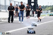Lewis Hamilton and Esteban Ocon racing remote control cars at Suzuka