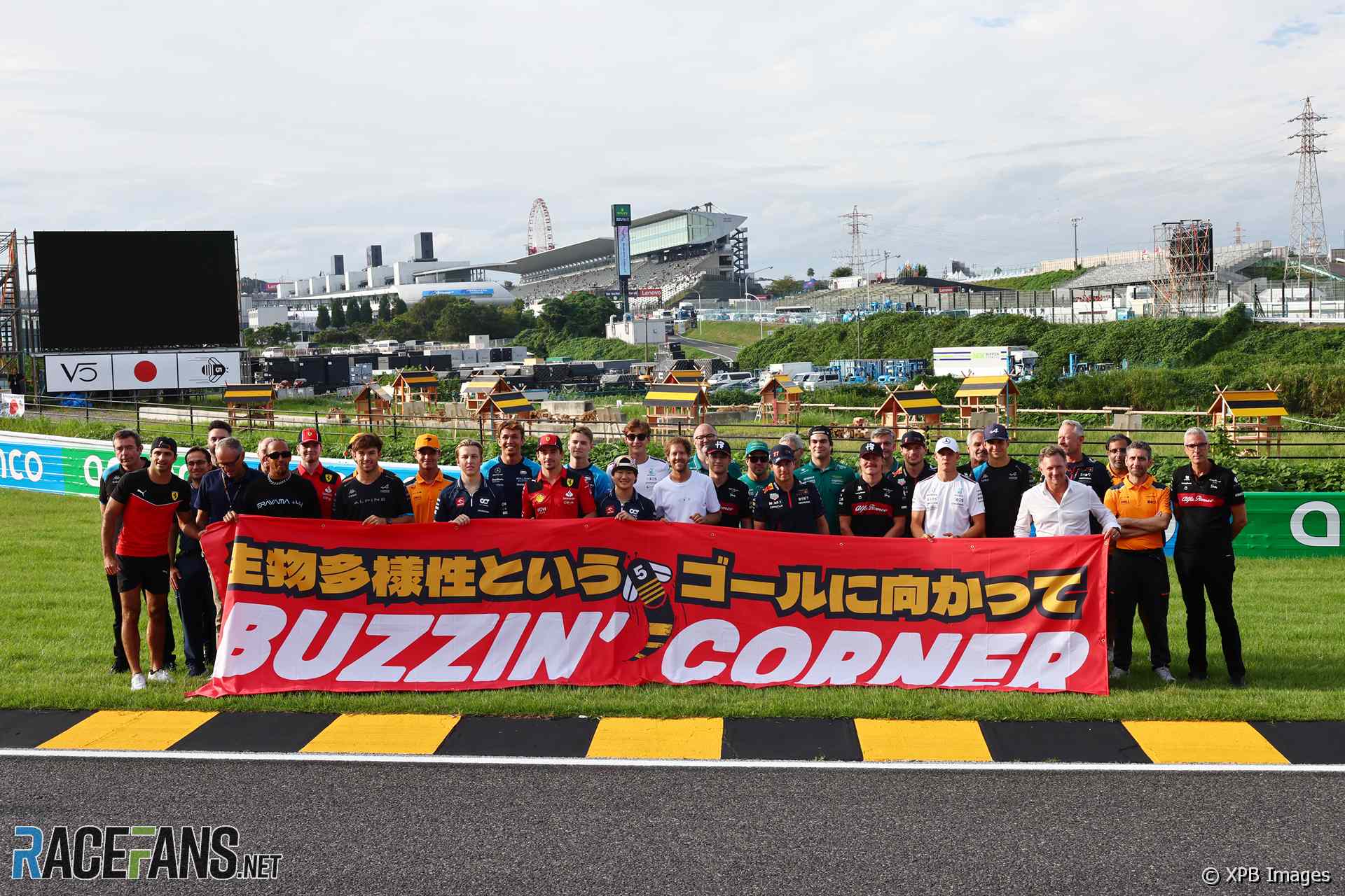 F1 drivers and team personnel at Buzzin' Corner, Suzuka, 2023